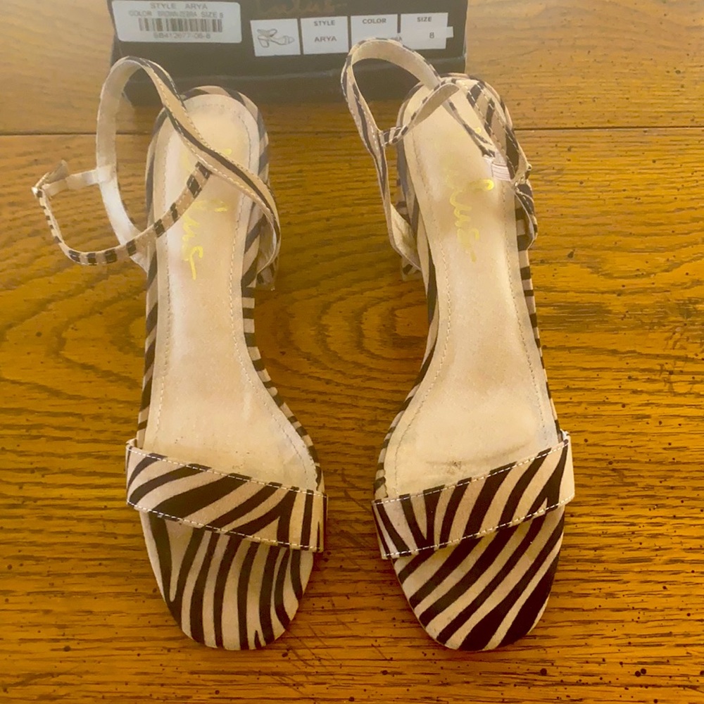 Women’s Zebra block heel sandals by Lulus
